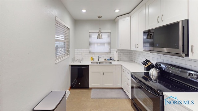 kitchen featuring white cabinets, a sink, light countertops, black appliances, and backsplash