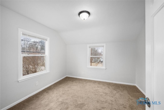 bonus room with carpet, baseboards, and vaulted ceiling