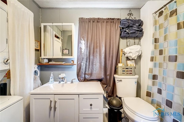 full bath featuring a shower with shower curtain, vanity, toilet, and a textured ceiling