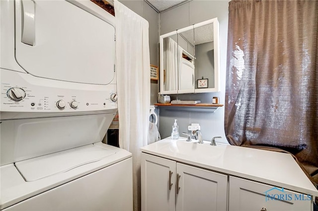 clothes washing area featuring laundry area, a sink, and stacked washer and clothes dryer