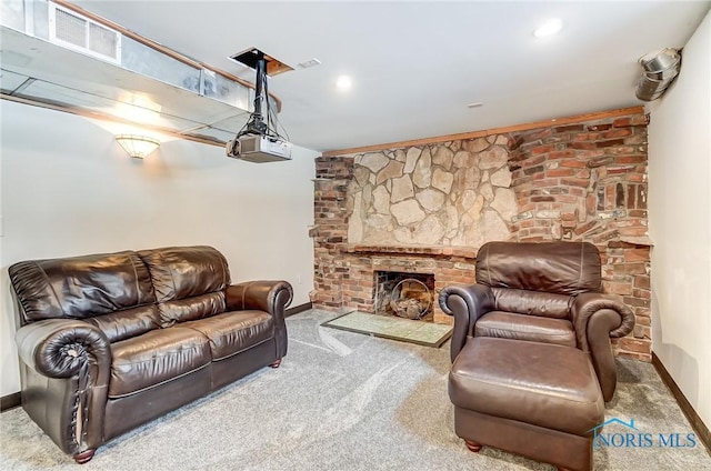 living area featuring carpet, a fireplace, visible vents, and baseboards