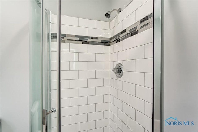 full bath featuring a shower stall