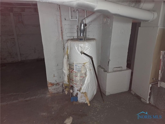 utility room featuring water heater