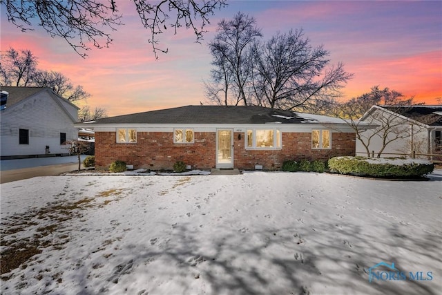 view of front of home featuring brick siding