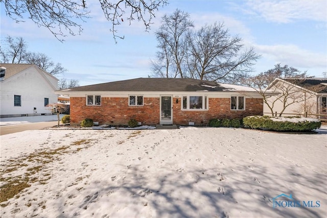 view of front of home with brick siding