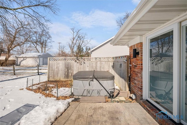 snow covered patio with fence