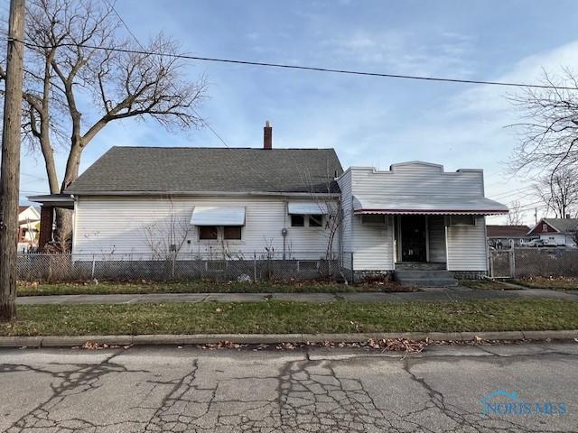 single story home with a fenced front yard