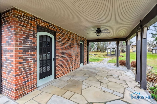 view of patio featuring ceiling fan