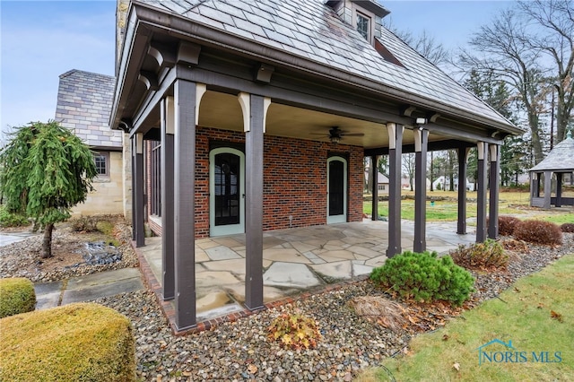 view of patio / terrace featuring ceiling fan and a gazebo