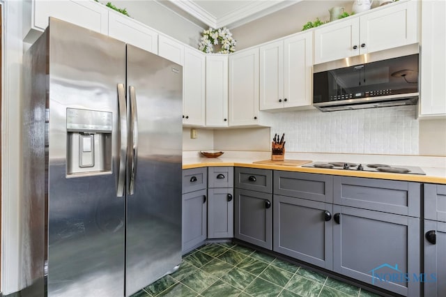 kitchen featuring appliances with stainless steel finishes, white cabinets, and gray cabinetry