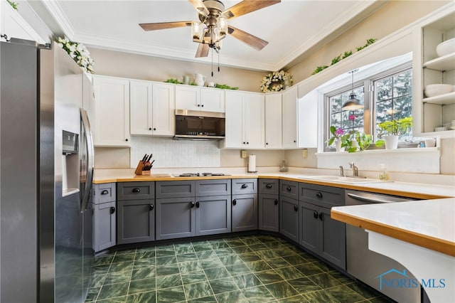 kitchen featuring light countertops, appliances with stainless steel finishes, gray cabinets, and white cabinetry