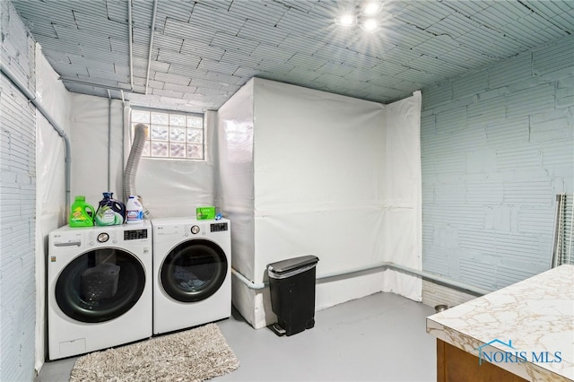 washroom with laundry area and separate washer and dryer