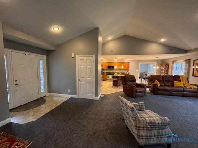 foyer entrance featuring recessed lighting, high vaulted ceiling, baseboards, and carpet floors