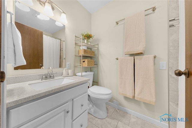 bathroom featuring tile patterned flooring, a shower with shower curtain, vanity, and toilet