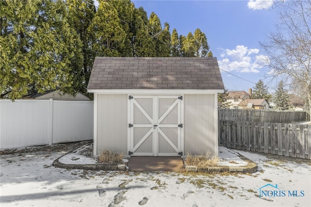 view of shed with a fenced backyard