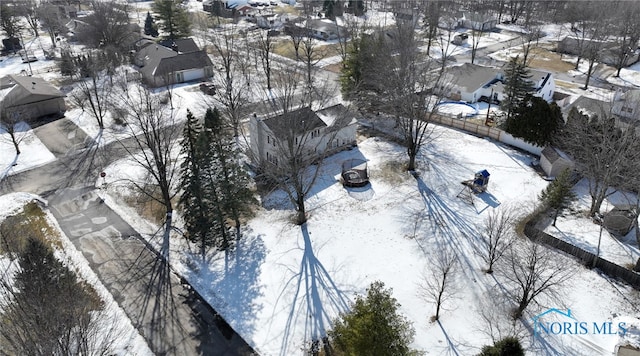 snowy aerial view with a residential view