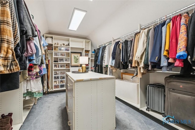 walk in closet featuring carpet