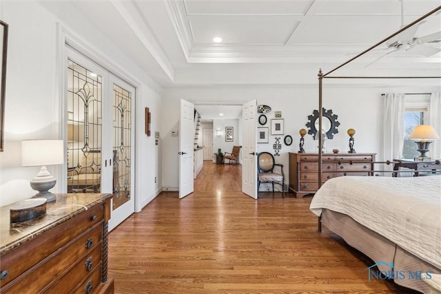 bedroom featuring baseboards, ornamental molding, light wood-style flooring, and recessed lighting