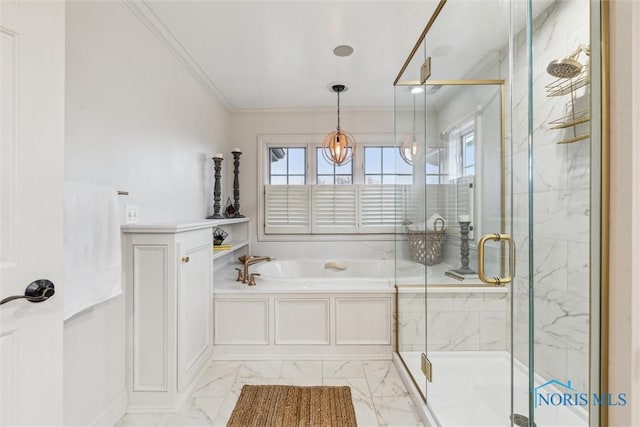 bathroom featuring marble finish floor, a stall shower, a garden tub, and crown molding