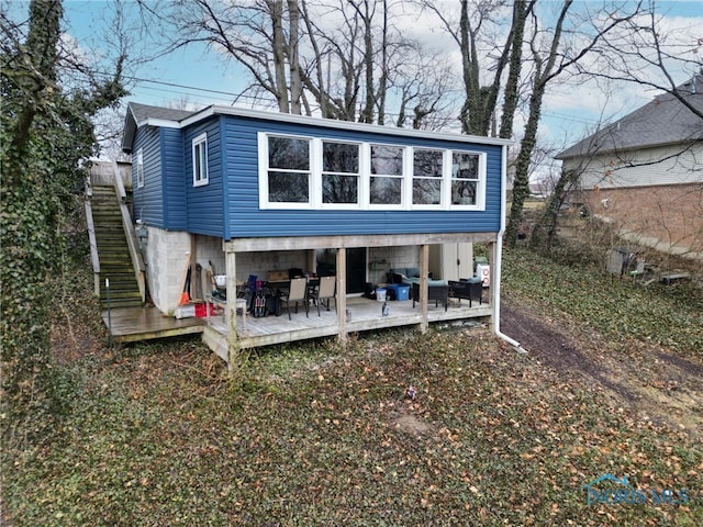 view of outbuilding with stairway