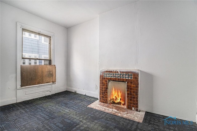 2618 Collingwood Blvd, Toledo, OH 43610 - unfurnished living room featuring a fireplace and baseboards