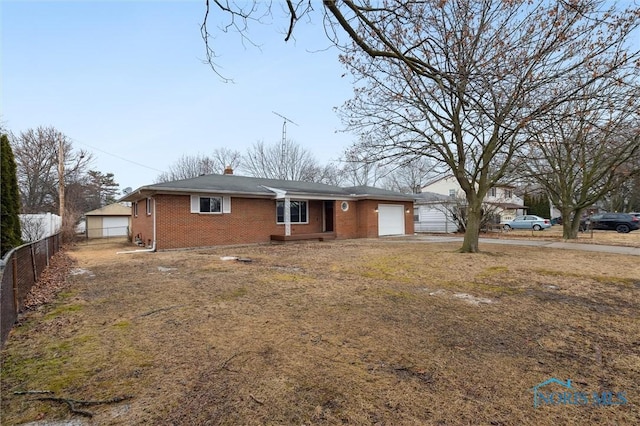 ranch-style home featuring brick siding, a chimney, fence, a garage, and driveway