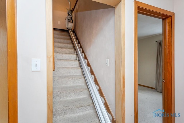 stairway featuring baseboards