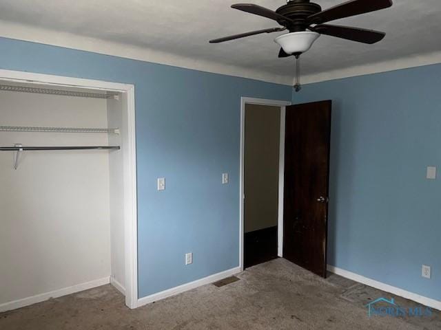 unfurnished bedroom featuring ceiling fan, carpet floors, a closet, and baseboards