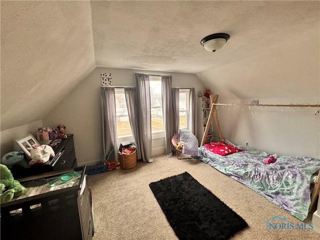 carpeted bedroom featuring lofted ceiling and a textured ceiling