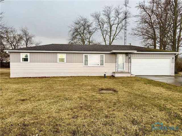 single story home featuring a garage, a front lawn, and concrete driveway