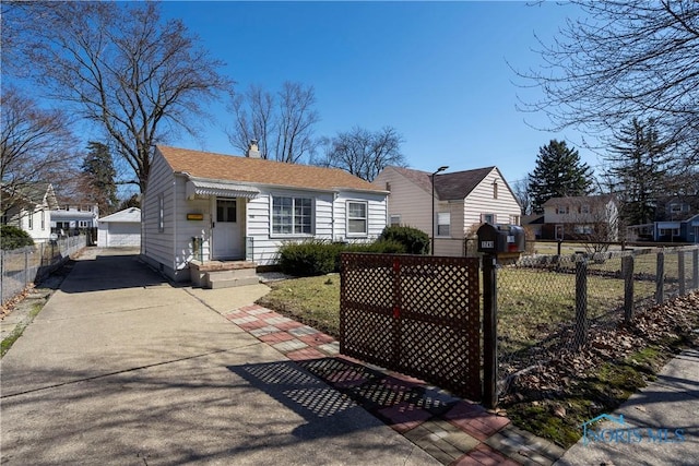 view of front of home with an outdoor structure, fence, a detached garage, and a chimney