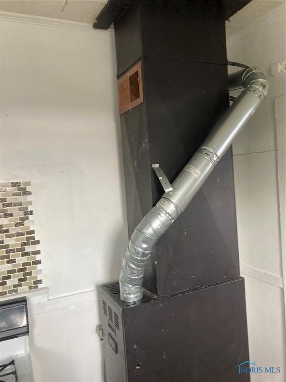 utility room with heating unit