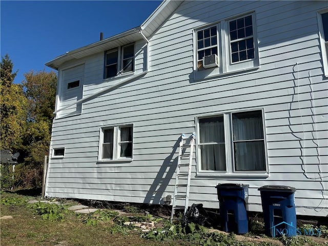 view of side of home with cooling unit