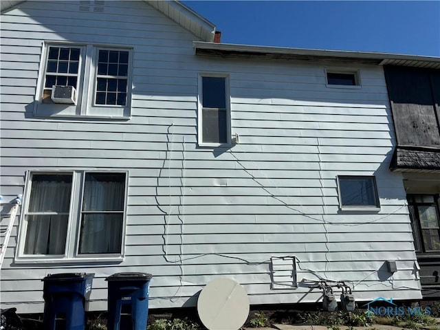 view of side of property featuring cooling unit