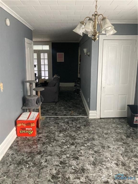 living area with baseboards, french doors, and crown molding