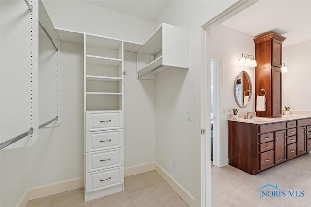 spacious closet with a sink