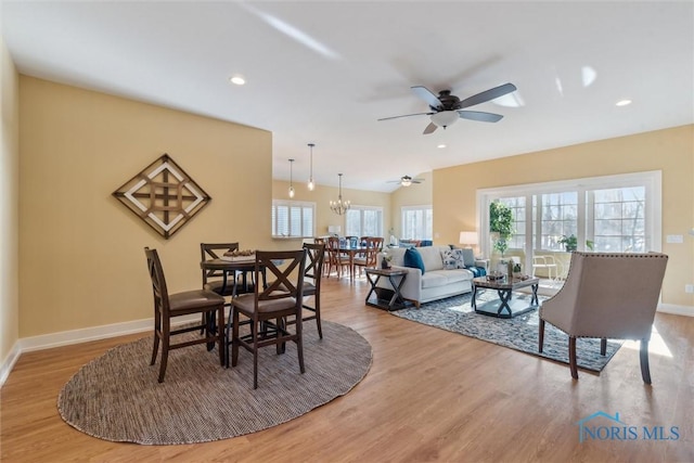 dining space featuring recessed lighting, wood finished floors, and baseboards