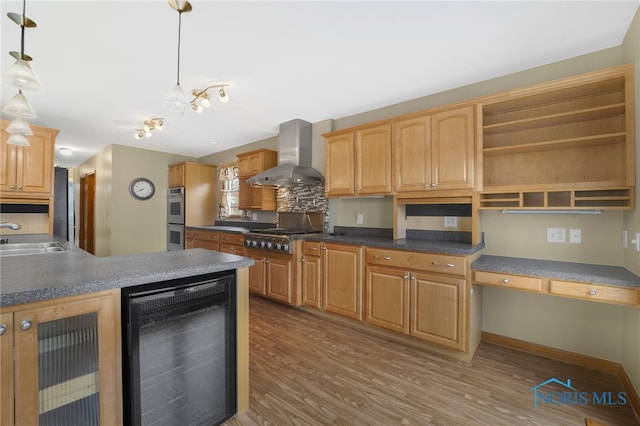 kitchen with wine cooler, stainless steel appliances, a sink, wall chimney range hood, and open shelves