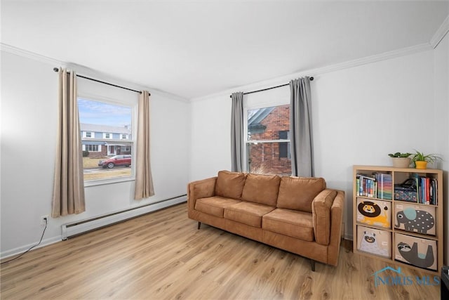 living area featuring a baseboard radiator, light wood-style flooring, and crown molding