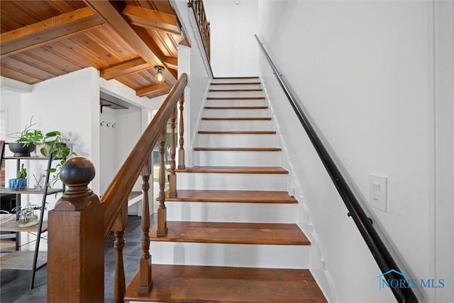 staircase with beamed ceiling and wood ceiling