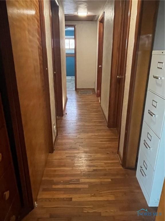 hallway with wood finished floors