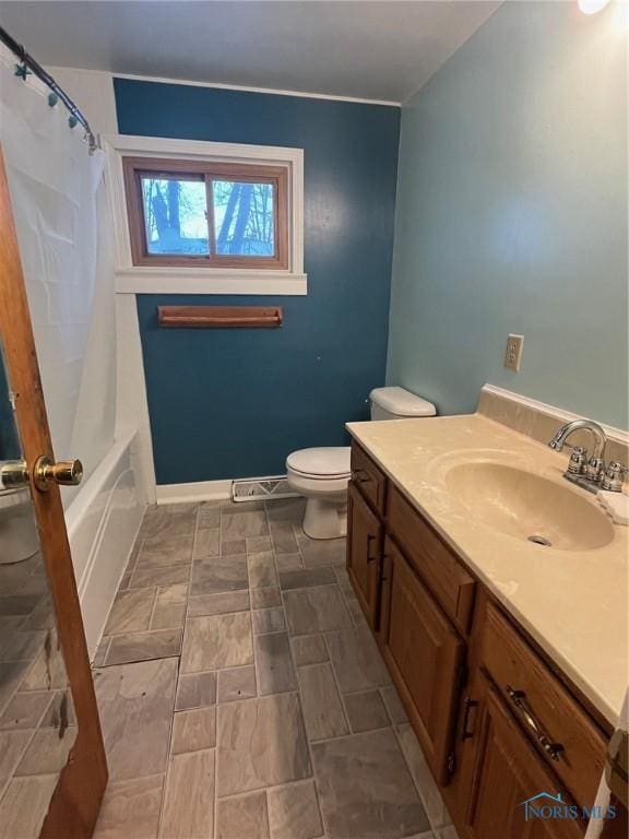 full bath featuring toilet and vanity