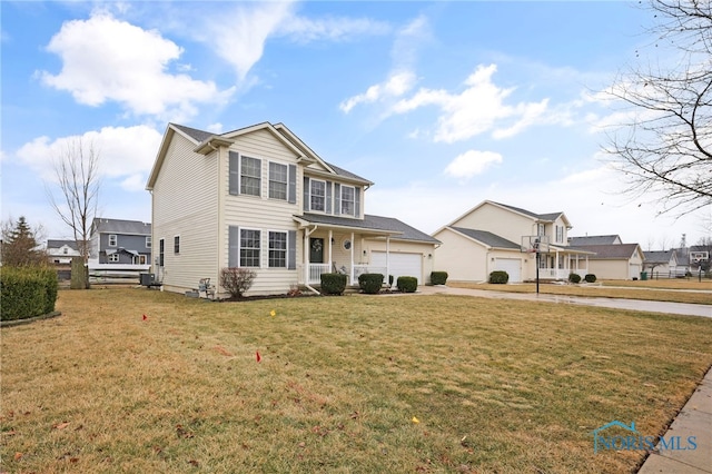 view of front of home with a front lawn, a residential view, driveway, and an attached garage