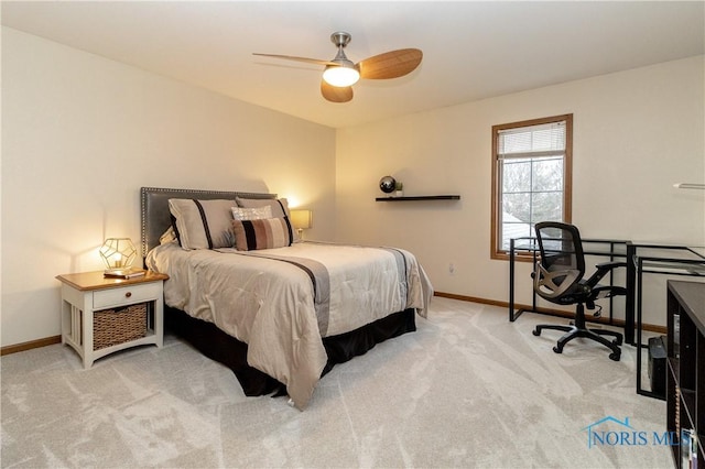 bedroom with a ceiling fan, carpet, and baseboards