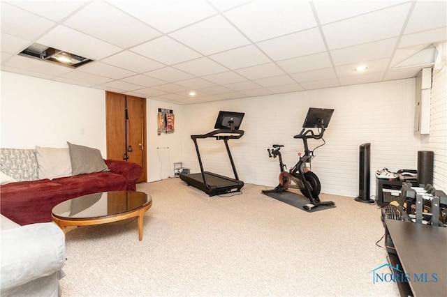 workout area with a drop ceiling and carpet
