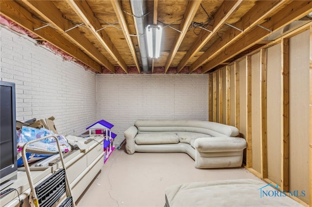 unfinished basement with brick wall