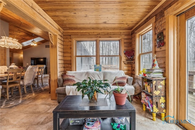 living area with wood ceiling, log walls, and vaulted ceiling