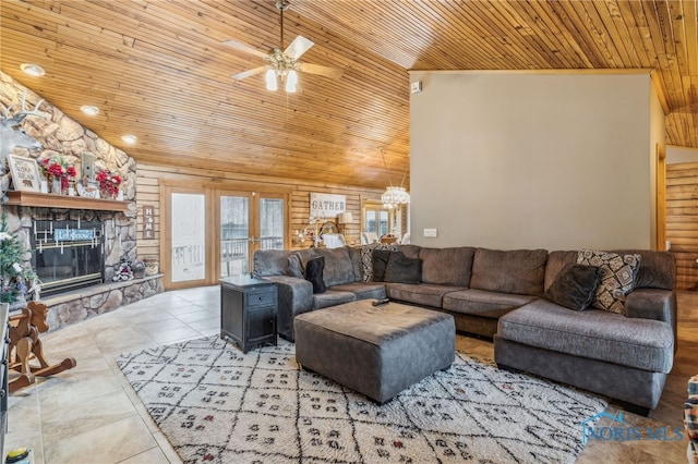 living area featuring french doors, a fireplace, vaulted ceiling, wooden ceiling, and tile patterned floors