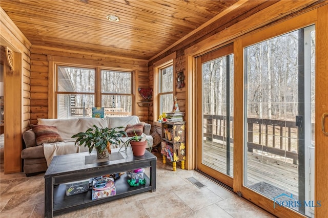 sunroom with wooden ceiling and visible vents