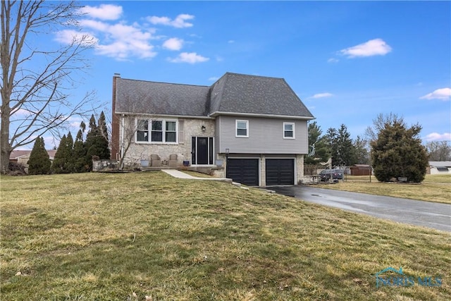 view of front facade with an attached garage, stone siding, aphalt driveway, and a front yard